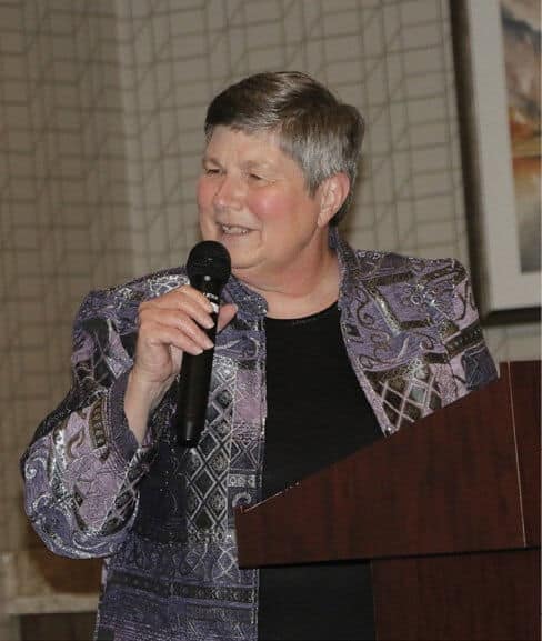 Pam Eddy saluting Larry Willeford, “The Right Stuff Award” Honoree.
