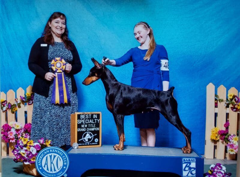 Micaela Kenyon with her Doberman Pinscher.