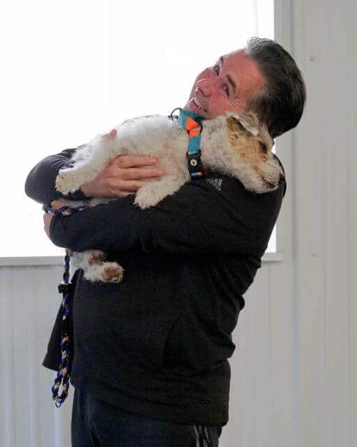 Team Tayto celebrating a great Premier run while keeping him away fromthe Poodles at the Mid-Hudson Agility Trial, February 2025. photo by Margaret Foxmoore