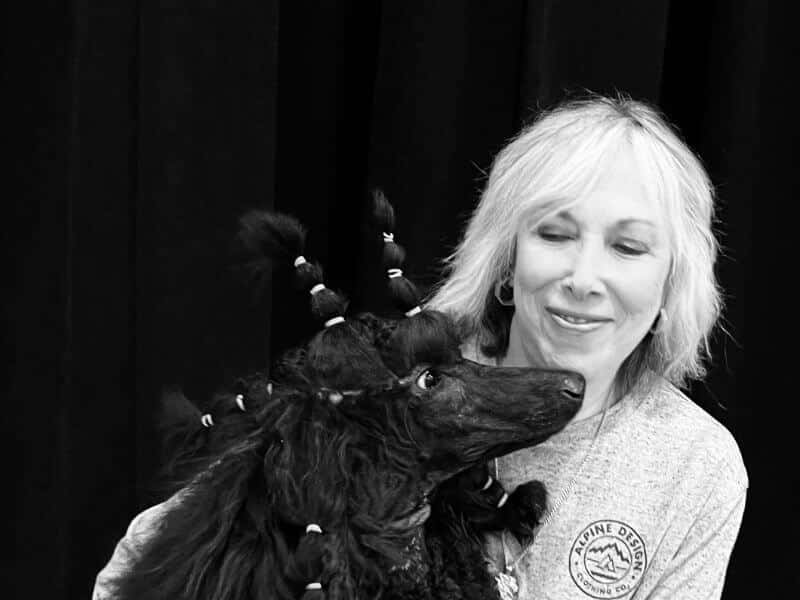 Black and white picture of Cynthia Horn with her dog.