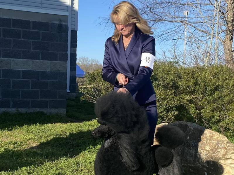 Elizabeth Reynolds with her Poodle.