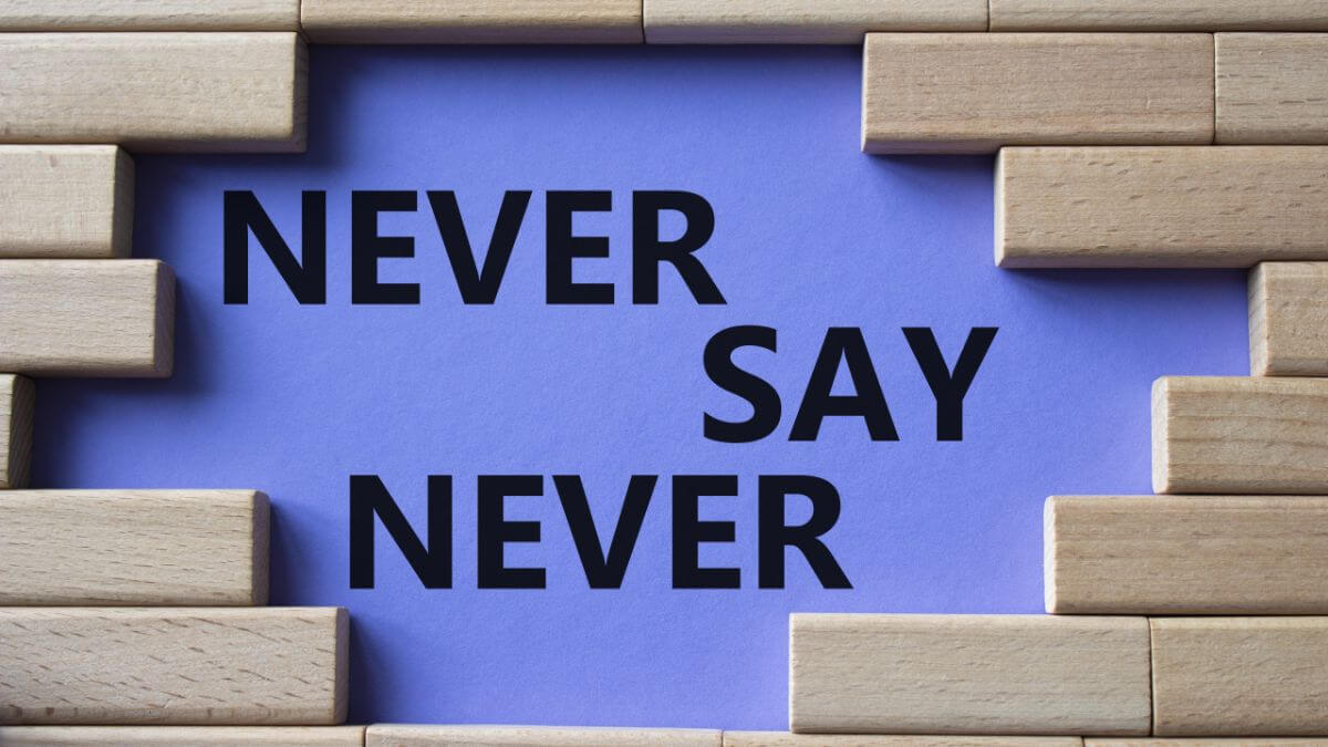 Never say Never symbol. Concept words Never say Never on wooden blocks.