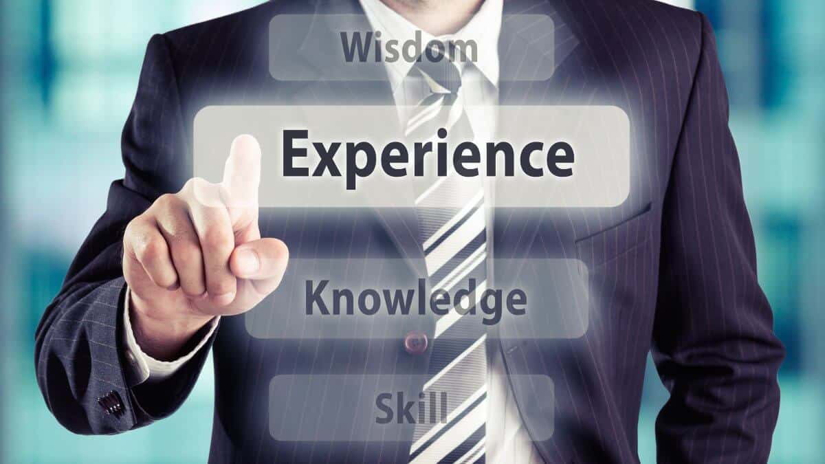 Businessman pressing experience button. Experience concept, toned photo.