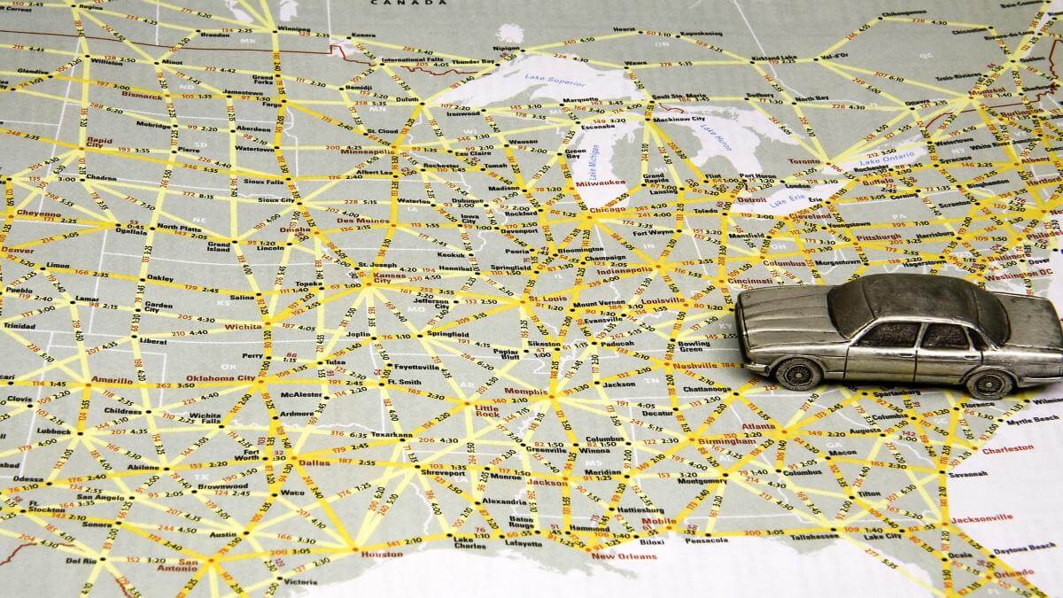 Model sedan on map of US highways.