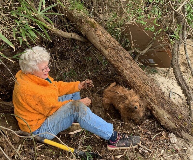 Heather Rife with her Aussie in the woods