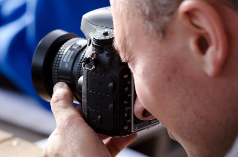 A person snapping a photo representing 2023 Westminster Kennel Club Photographers