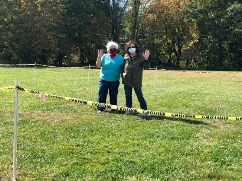 Mary Lange and Jackie Caruso working hard to set up for the four Collie Specialty weekend.