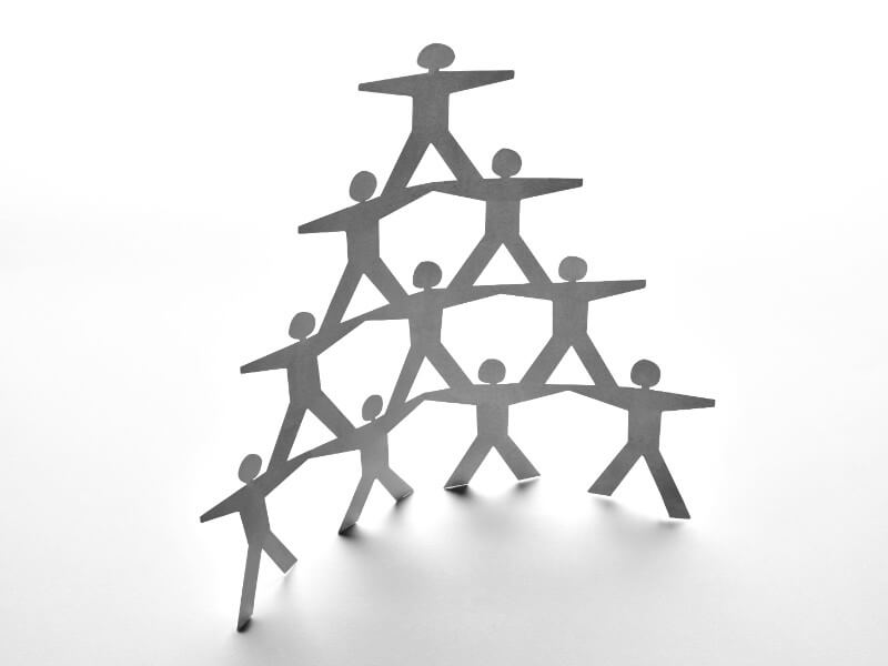 close up of paper people on white background