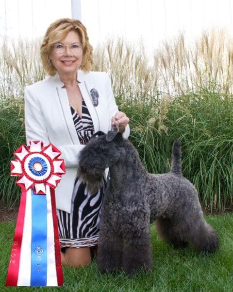 Lois Grier posing with her dog.