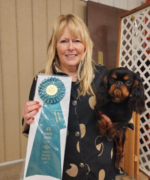 Karri Meyers posing with her dog.