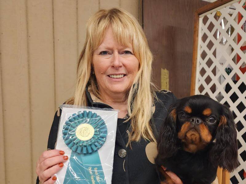 Karri Meyers posing with her dog.