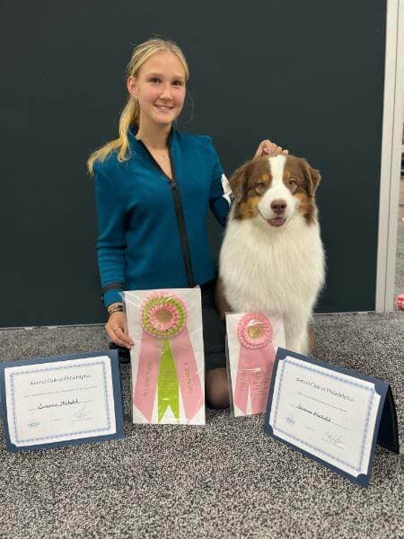 Savanna Michalak and her dog winning awards.