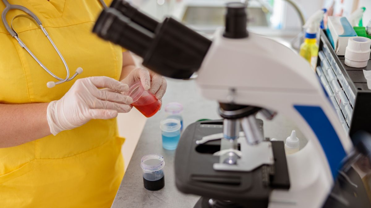 Laboratory assistant conducting researches in veterinary laboratory.
