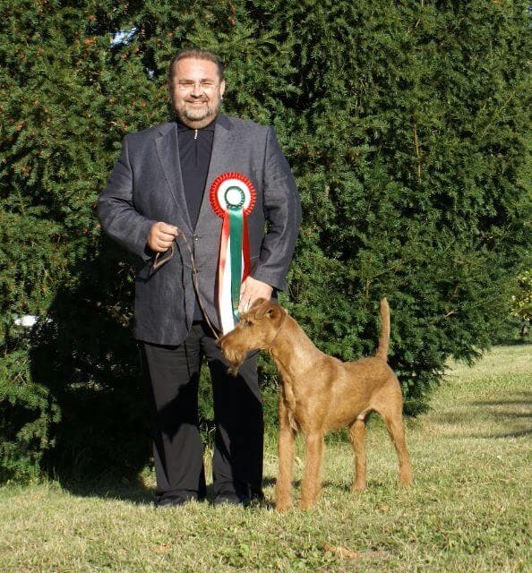 Hans E. Gruettner with an Irish Terrier.