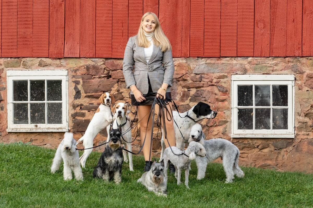 Lydia Frey with a pack of dogs