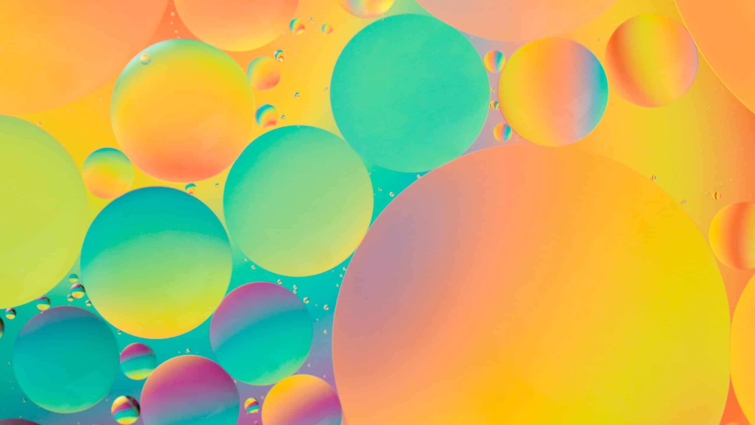 Oil drops on water with colorful gradient background