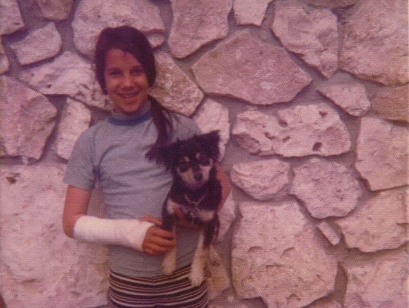 Young Ronda Agrue with her pomeranian mix dog "Linus"