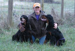 Rhonda Cornum of Munroc Farm Kennel, with two of her Gordon Setter dogs