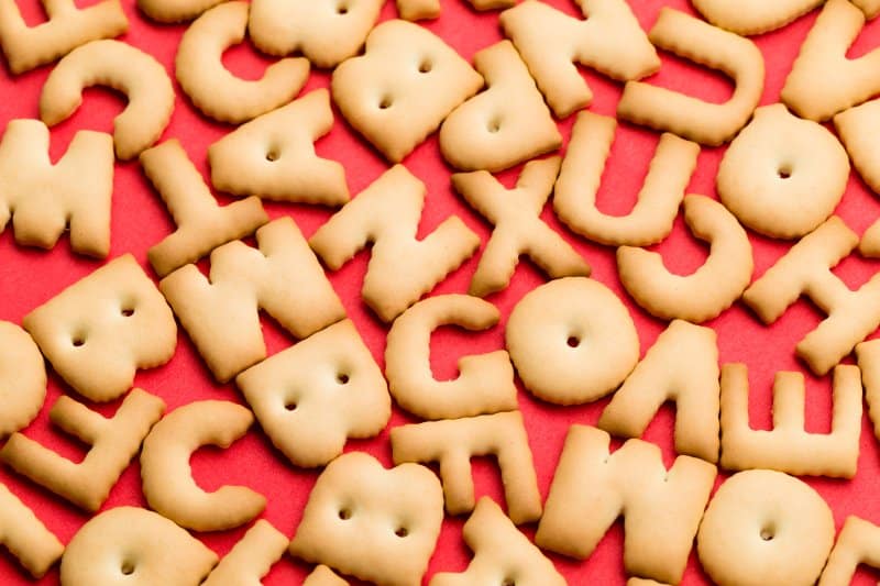 word biscuit over red background