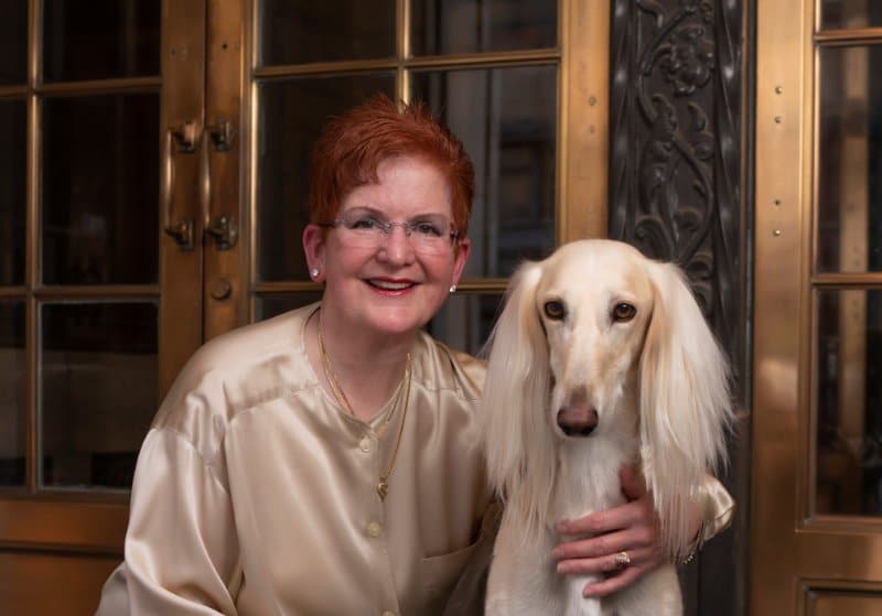 Julie Mueller, the breeder of Aurora Kennel with her Saluki dog