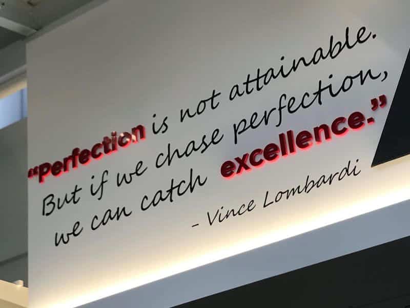 An attainable sign for perfectionists promoting excellence.