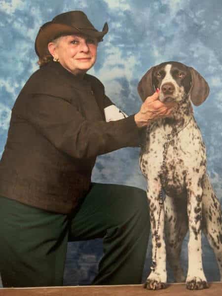 Terry M. DePietro posing with her dog.