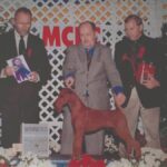 John Childers going Winners Dog at Montgomery 1999 with Ch. Baystone Firehawk. Bobby Fisher is the Judge and ITCA President Bruce Petersen is presenting.