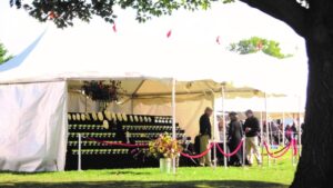 Old photo of a Morris & Essex Kennel Club Dog Show, showing people standing under white tents.