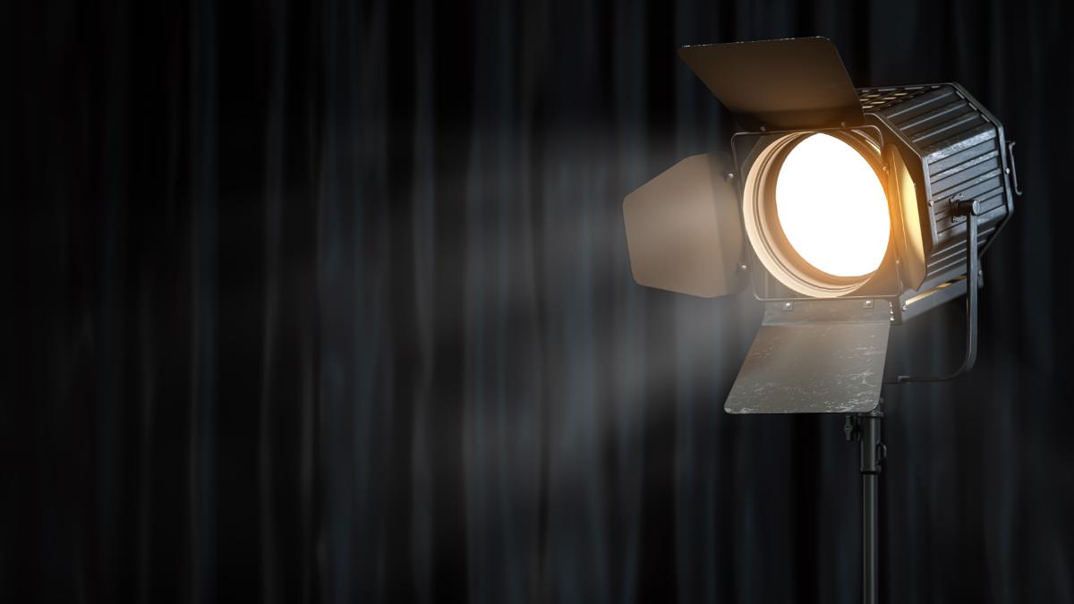 stage-or-studio-spotlight-on-black-curtain-backgro-2025-03-07-19-12-47-utc-1-1.jpg