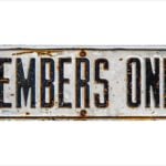 An Isolated Rustic Members Only Sign On A White Background