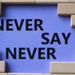 Never say Never symbol. Concept words Never say Never on wooden blocks.