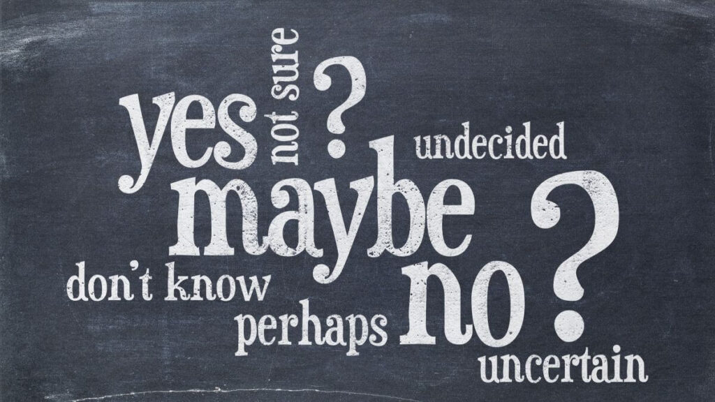 Undecided or uncertain concept - yes, no, maybe word cloud on a vintage blackboard