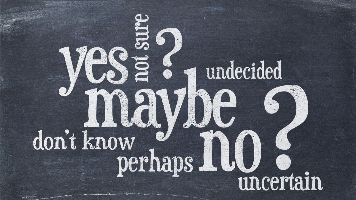 Undecided or uncertain concept - yes, no, maybe word cloud on a vintage blackboard
