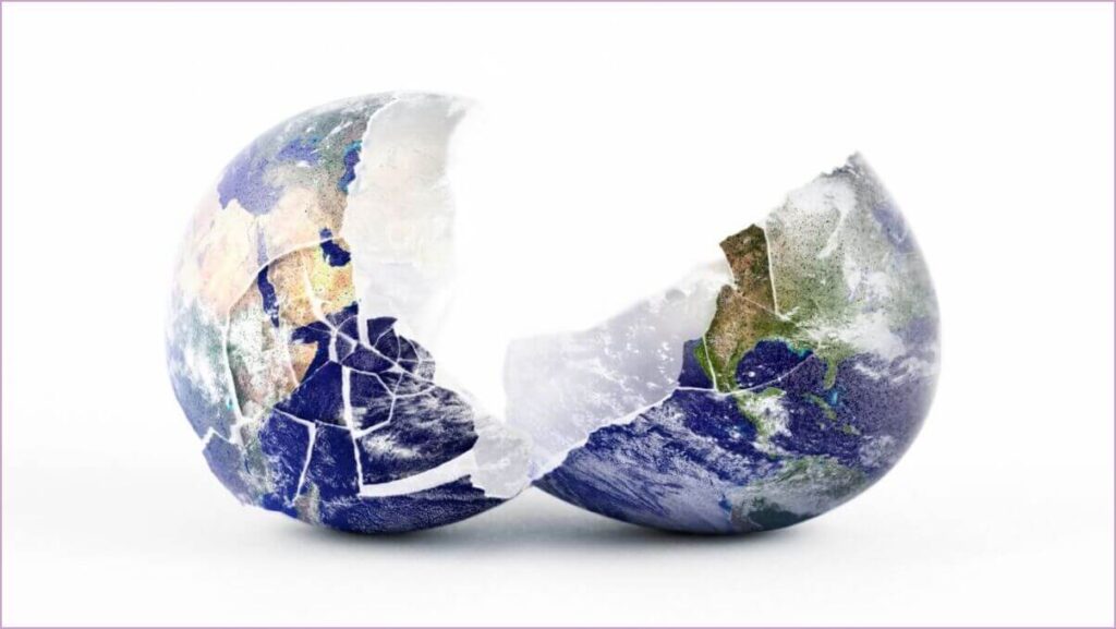 Broken world. An image of the Earth as a broken egg split in two halves.