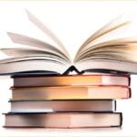 Composition with stack of books isolated on white