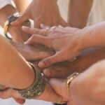 Close up with lot of women hands holding and touching each other for friendship concept.