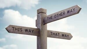 Which way to go road sign. Crossroad signpost saying this way, that way, the other way concept for lost, confusion or decisions