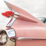 Retro styled rear end of a classic pink Cadillac fifties car in Den Bosch, The Netherlands