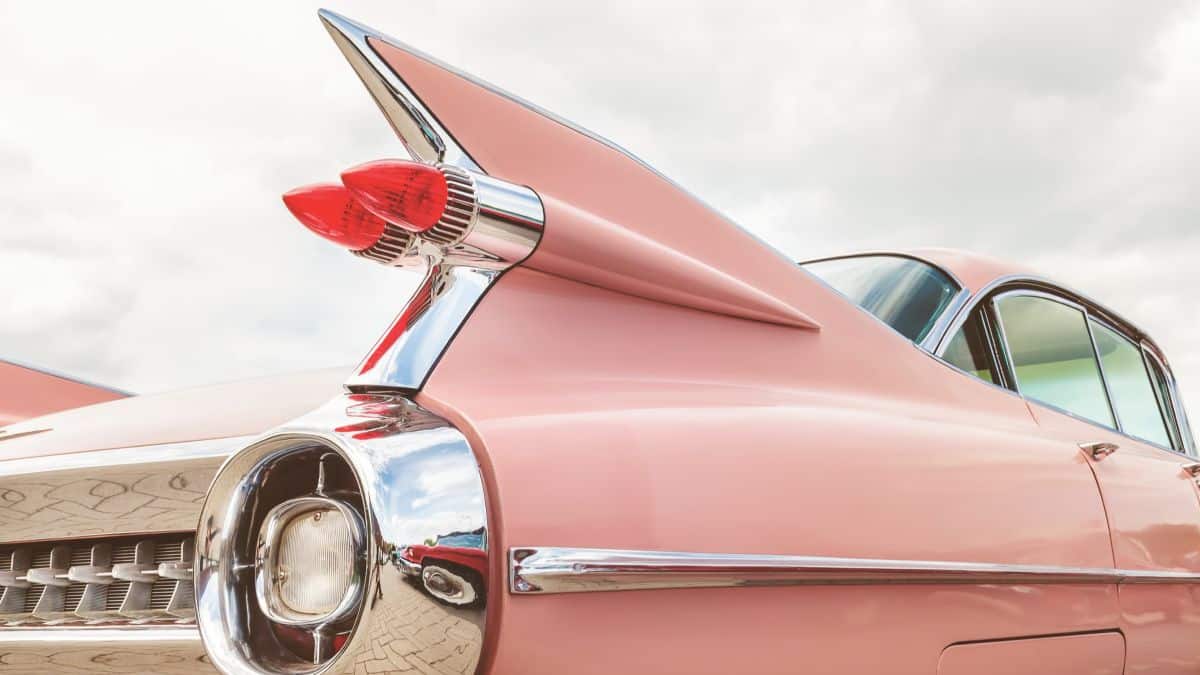 Retro styled rear end of a classic pink Cadillac fifties car in Den Bosch, The Netherlands