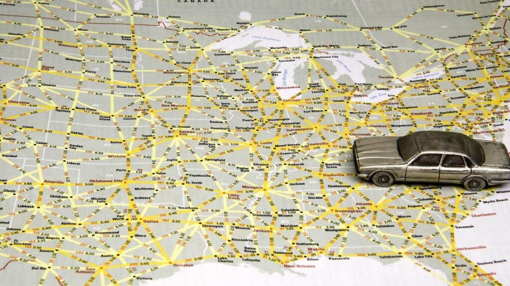 Model sedan on map of US highways.