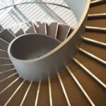 Wide-angle view down a spiral stairs from the high point