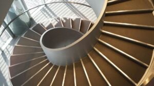 Wide-angle view down a spiral stairs from the high point