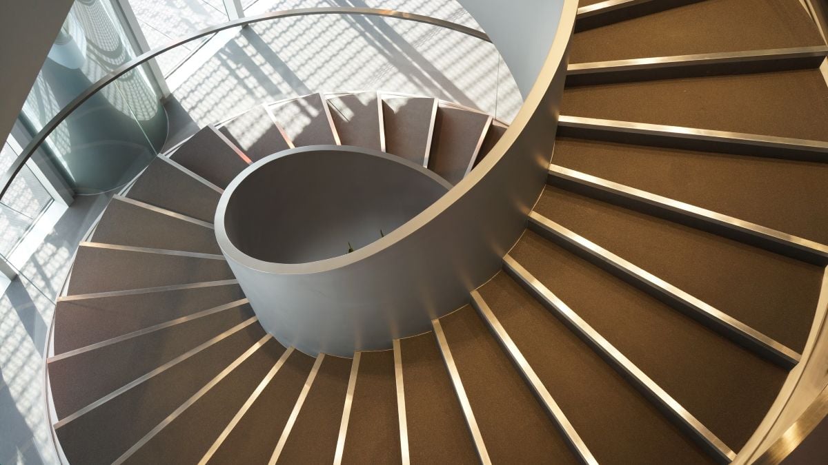 Wide-angle view down a spiral stairs from the high point